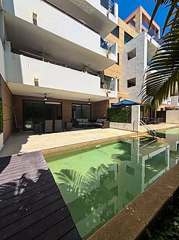 Renta exclusivo departamento en Playa del Carmen con alberca privada y club de playa en Lorena Ochoa